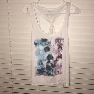 a white tank top with designs